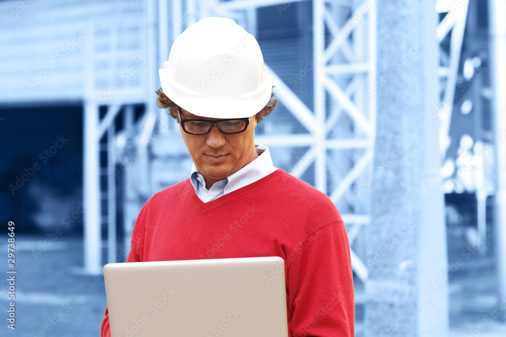 Engineer In Hardhat With Laptop Engineer In Hardhat With Laptop