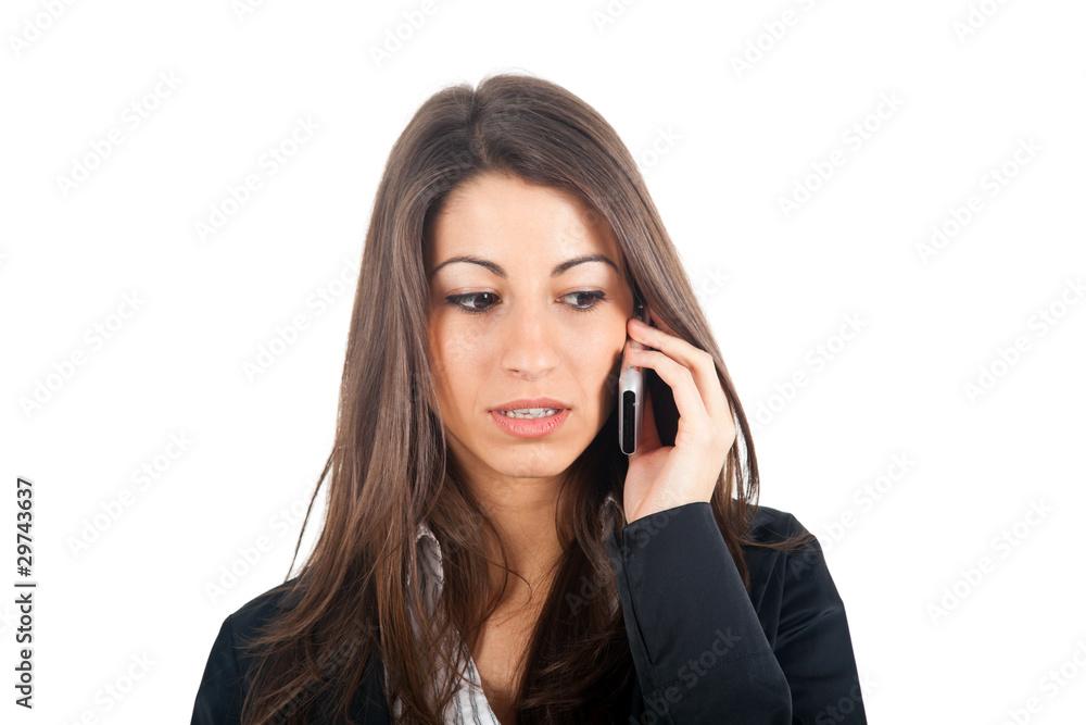 Thoughtful businesswoman talking at the phone isolated on white Thoughtful businesswoman talking at the phone isolated on white
