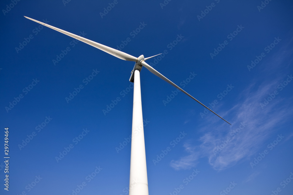 white wind turbine generating electricity on blue sky white wind turbine generating electricity on blue sky