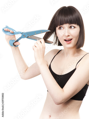Portrait of woman making an haircut herself