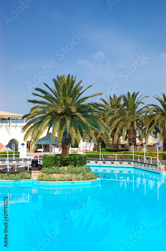 Swimming pool and palm trees at the luxury hotel, Crete, Greece