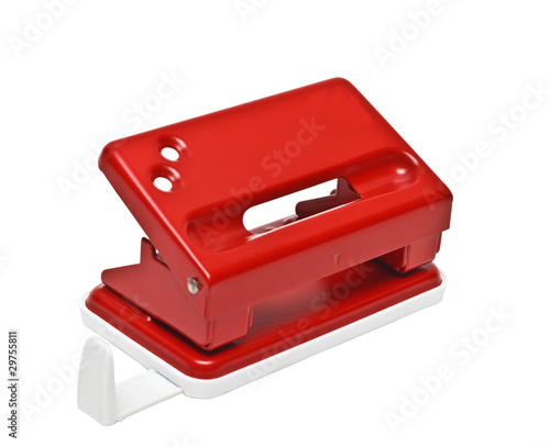 Red office hole punch on a white background