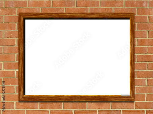 Whiteboard on red brick wall