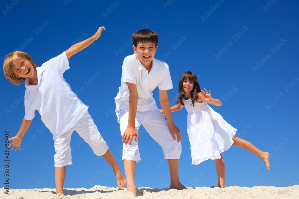 Happy siblings on beach Happy siblings on beach