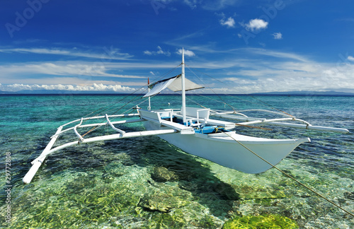 Beautiful beach with boat photo