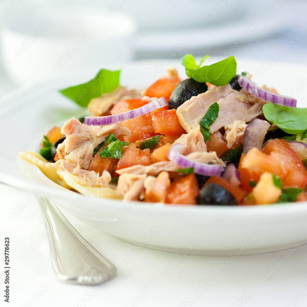 Freshly prepared tuna salad with fresh tomato and pasta