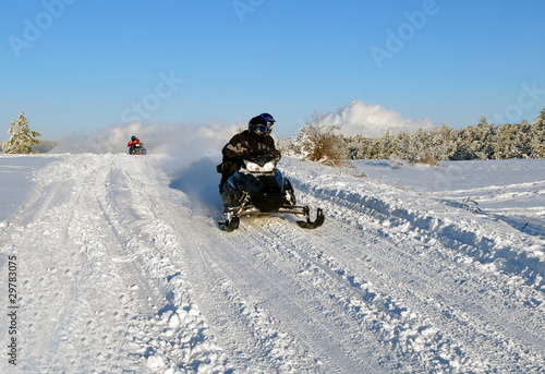 mans goes on a snowmobile