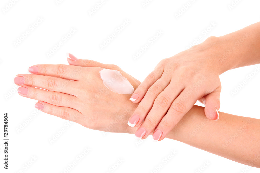 Closeup of beautiful female hands applying hand cream isolated o Closeup of beautiful female hands applying hand cream isolated o