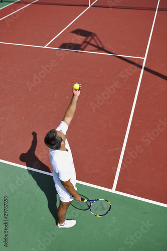 young man play tennis outdoor © .shock