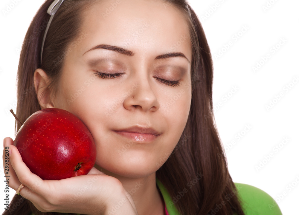 Young smiling woman with apple isolated on white Young smiling woman with apple isolated on white