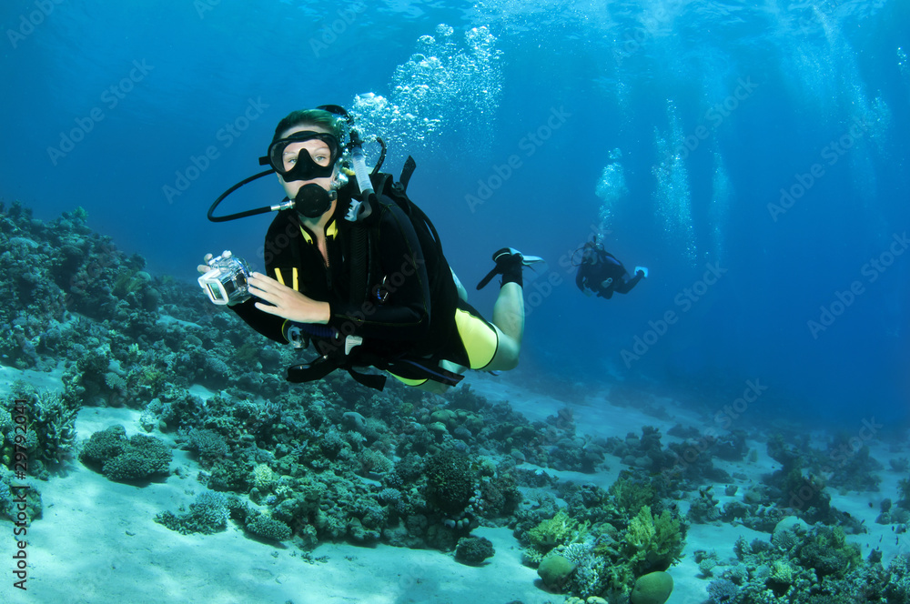 female scuba diver with camera female scuba diver with camera