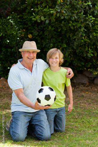 Grandfather and his grandson looking at the camera