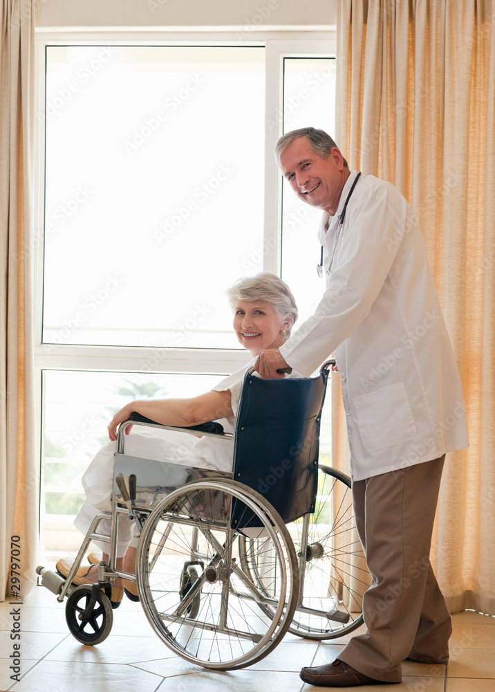 Doctor with his patient looking at the camera Doctor with his patient looking at the camera