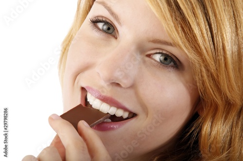young beautiful woman with a bar of chocolate  white background 