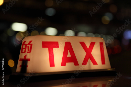 Photography Taxi sign at night in Hong Kong