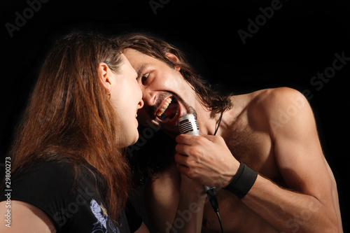 Sing two soloist rock band on the black background