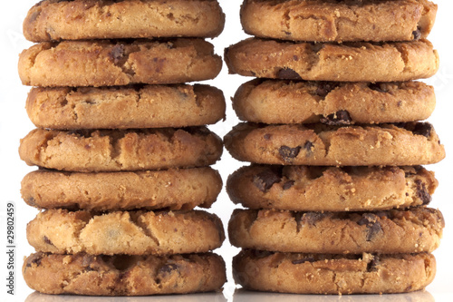 Two piles of chocolate chip cookies