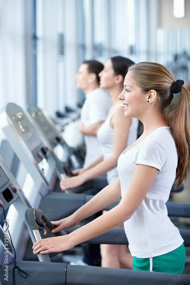 Attractive young people engaged in fitness Attractive young people engaged in fitness