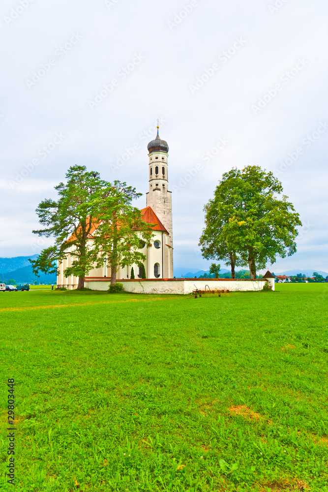 typical bavarian or austrian landscape with a chapel