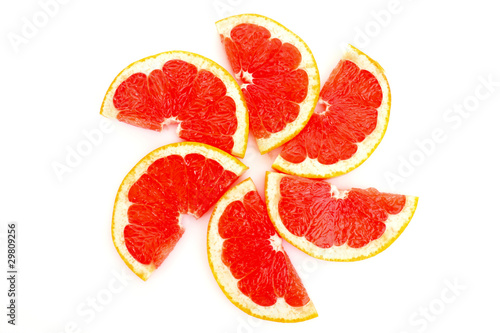 Slices of grapefruit in the form of circle isolated on white