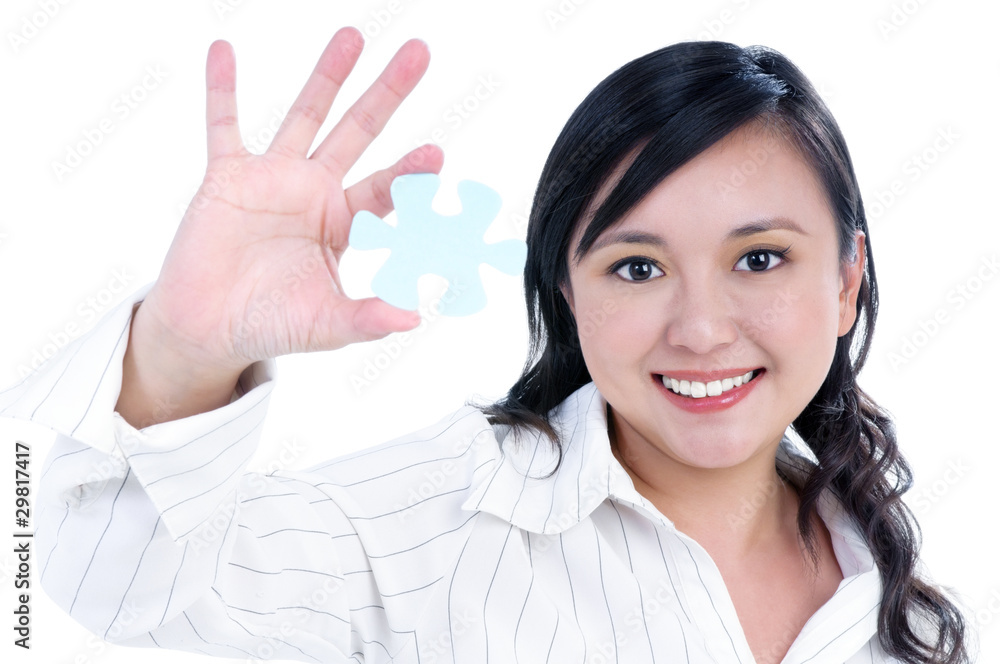 Happy young businesswoman holding jigsaw puzzle Happy young businesswoman holding jigsaw puzzle