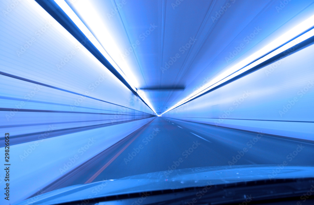 Fast drive through  a tunnel in blue color tone