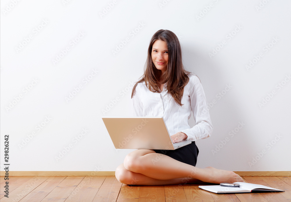 Young business woman at home with notebook Young business woman at home with notebook
