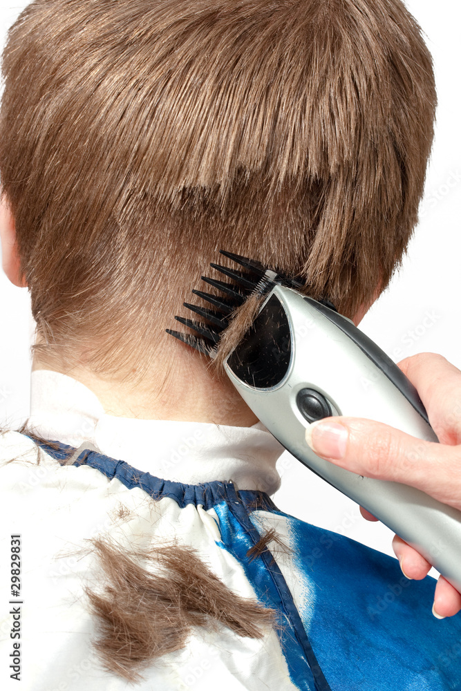 Fototapeta premium Hairstyle machine, kind in the rear