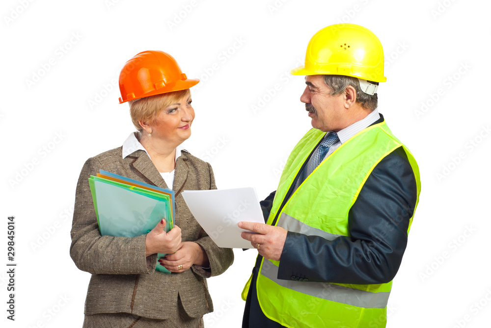 Smiling mature engineers having conversation Smiling mature engineers having conversation