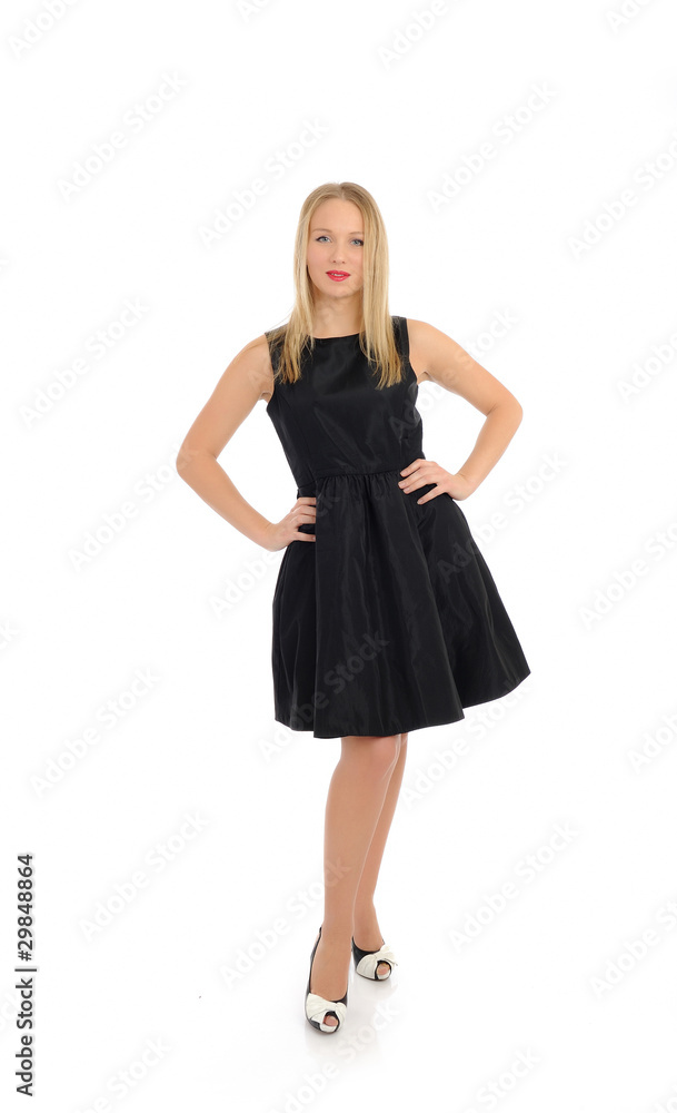 Beautiful sexy woman in elegant dress standing. studio shot. iso