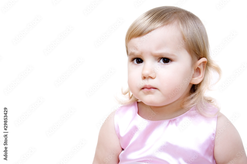 Serious little girl isolated on white background Serious little girl isolated on white background