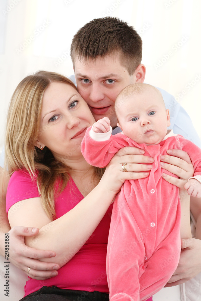 Happy family with the chest baby on hands Happy family with the chest baby on hands