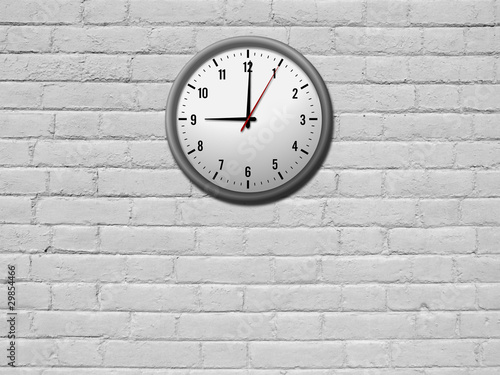 Clock on white brick wall