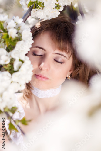 Beautiful young woman dreaming outdoors