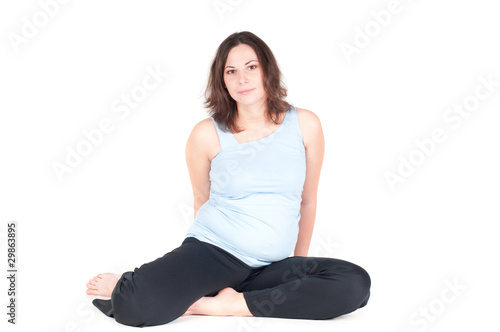 Portrait of pretty pregnant woman practicing yoga