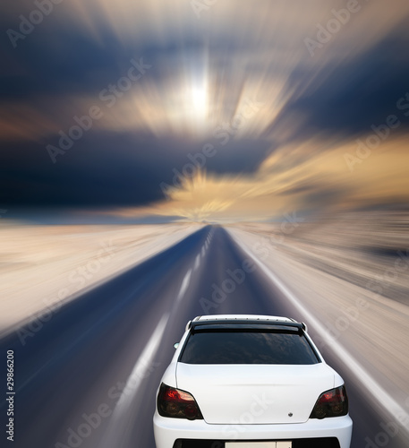 White car on desert road