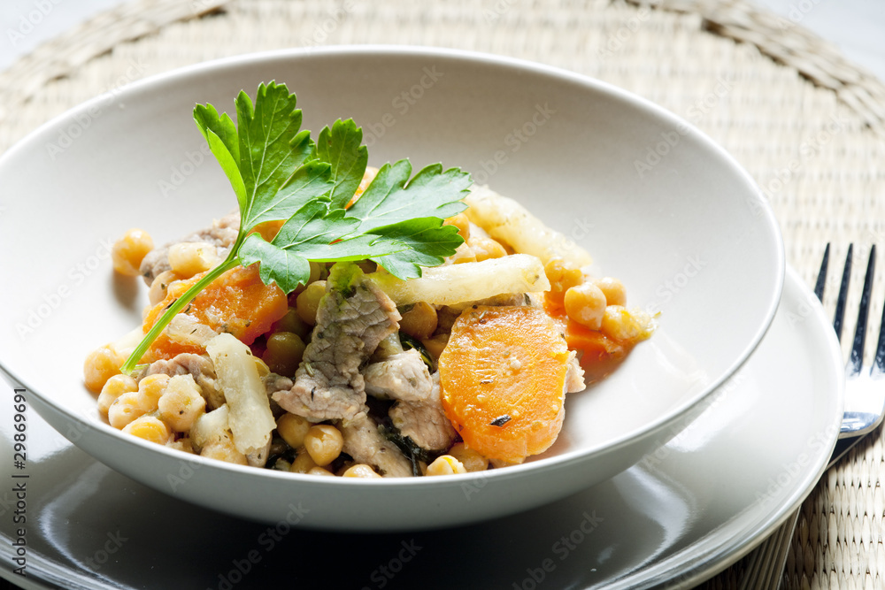 pork meat on celery with carrot and chick peas pork meat on celery with carrot and chick peas