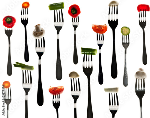Many slice of vegetables in forks