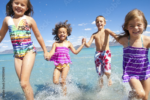Kids playing at the Beach © Brocreative