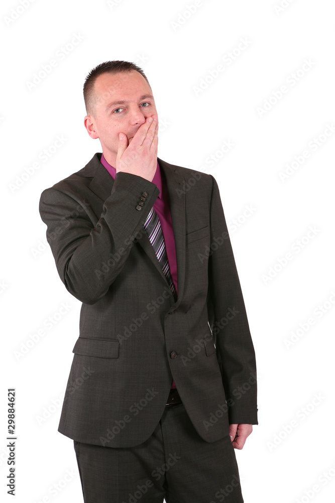Young businessman covering his mouth with his hand Young businessman covering his mouth with his hand