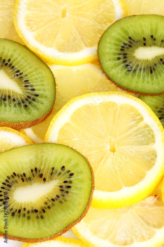 Kiwi and lemon slices on white background