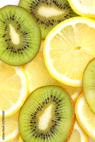 Kiwi and lemon slices on white background