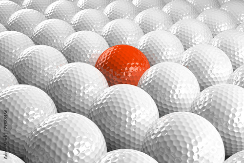 White Golf balls & one orange in the middle