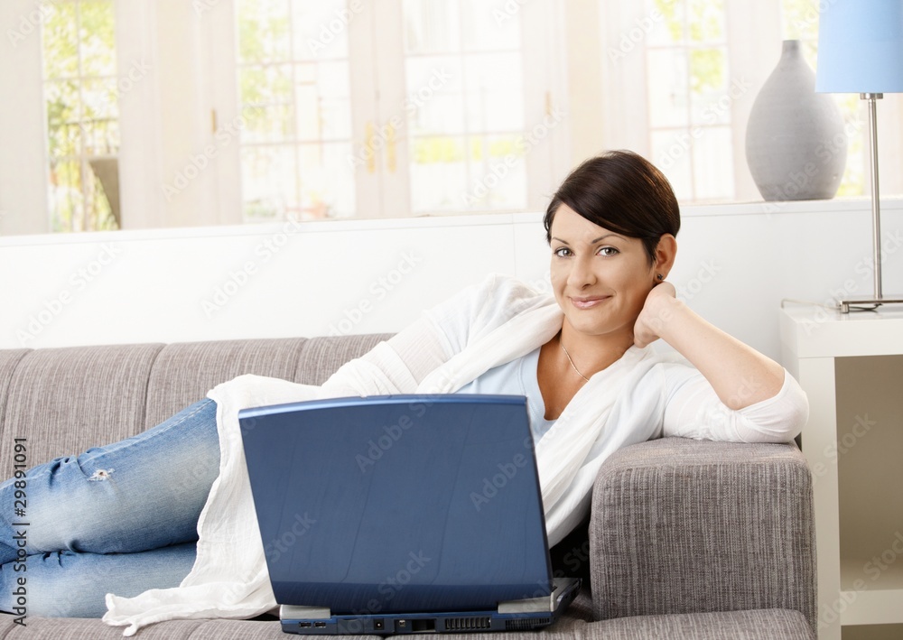 Happy woman browsing internet Happy woman browsing internet