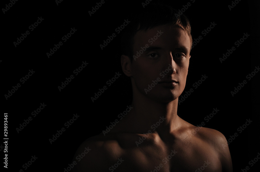 Naklejka premium young sportsman with a bare torso