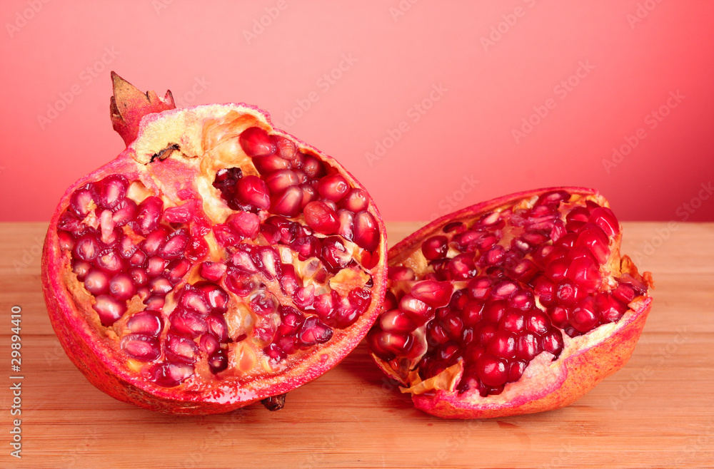 pomegranate isolated on wooden table pomegranate isolated on wooden table