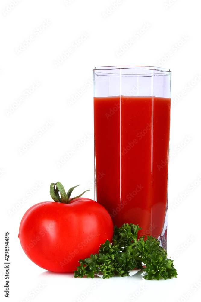 Glass of fresh tomato juice and tomatoes round the glass on th Glass of fresh tomato juice and tomatoes round the glass on th