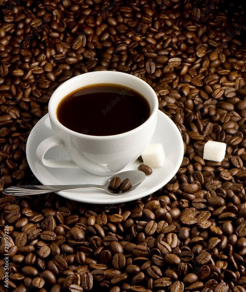 cup of coffee on beans cup of coffee on beans