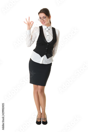 young business woman in glasses shows okay sign