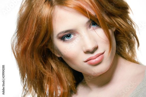 Sexy young woman with red hair and natural makeup